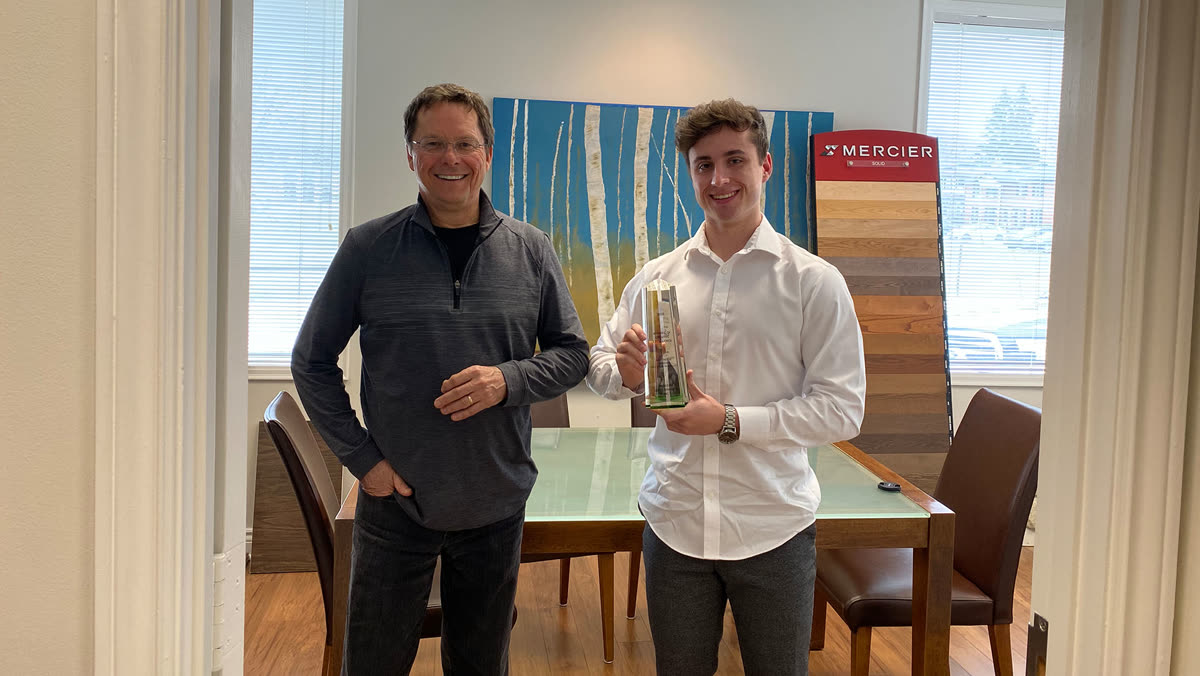 Shane Fry receiving an award for his web development work
